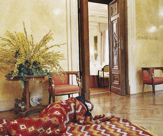 ERWIN WURM, Indoor Sculpture CC-Graz (Man in carpet: Indoor Sculpture CC-Graz (Man in carpet), 2001 Color coupler print, printed 2003. 39 x 46 3/4 in. (99.1 x 118.7 cm). Signed, titled, dated and numbered 2/5 in ink on a label affixed to the reverse of