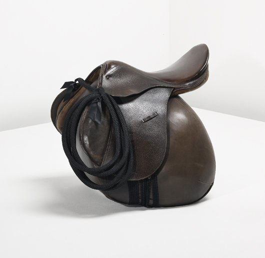 IKA KUENZEL, "Caution! This is Rodeo" chair, 2006: Caution! This is Rodeo" chair, 2006 Original leather stock saddle, synthetic rope, painted metal, ribbon, plastic, brass. 24 1/2 x 24 7/8 x 23 5/8 in. (62.2 x 63.2 x 60 cm.). Number one from the editi