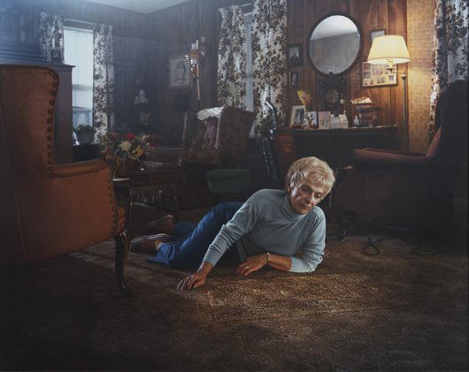 GREGORY CREWDSON, Untitled (Rug Lady) Twilight Ser: Untitled (Rug Lady) Twilight Series, 1999 C-print. 50 x 60 in. (127 x 152.4 cm). Signed "Gregory Crewdson" on a label adhered to the reverse. This work is from an edition of 10. PROVENANCE Luhring Aug