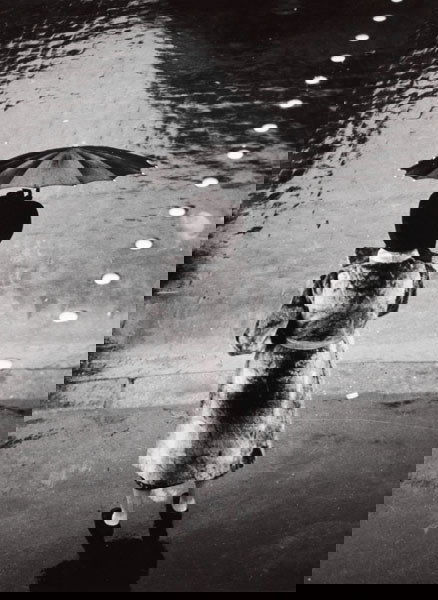 GERMAINE KRULL (Polish, 1897-1985) UNTITLED FRO: BRASSAÏ (GYULA HÀLASZ)(French, b. Transylvania, 1899-1984)LA FEMME AU PARAPLUIE, RUE DE RIVOLI, 1937gelatin silver print, pr