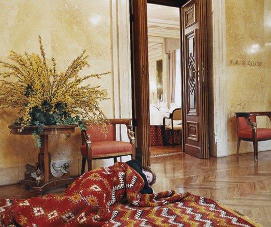 ERWIN WURM, Series CC: Graz Man with carpet, 2001,: Series CC: Graz Man with carpet, 2001, printed 2003 Color coupler print. 39 x 46 3/4 in. (99.1 x 118.7 cm). Signed, titled, dated "Erwin Wurm Series CC: Graz Man with carpet 2001/03" and numbered of f