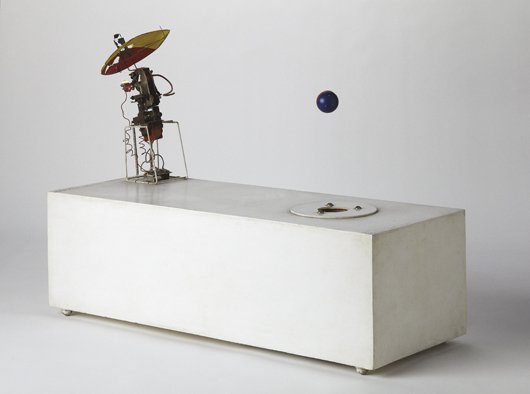 ENRIQUE CASTRO-CID, Robot with Flying Object Number: THIS LOT IS SOLD WITH NO RESERVE Robot with Flying Object Number Three, 1965 Wood box with motor, metal and printed paper. Signed and dated "Castro Cid. 64." on the underside. 21 x 28 3/4 x 11 in. (53