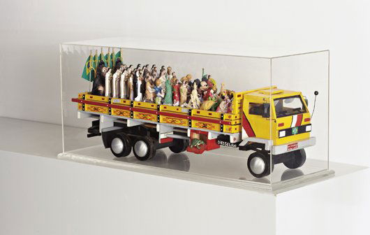 NELSON LEIRNER, Romaria, 2000: Romaria, 2000 Painted wood, plastic and ceramics. 31 × 77.5 × 21 cm (12 1/4 × 30 1/2 × 8 1/4 in). Signed and dated 'Nelson Lierner 2000' on the underside. ‡ ♠ PROVENANCE Private Collec