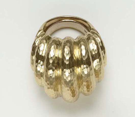 DAVID WEBB, A Gold Ring: A Gold Ring Of hammered bombé design, mounted in 18K yellow gold, size 7 1/2. Signed 'Webb' for David Webb.