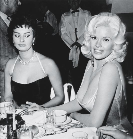 JOE SHERE, Jayne Mansfield and Sophia Loren at Roma: Jayne Mansfield and Sophia Loren at Romanoff's in Beverly Hills, 1958 Gelatin silver print, printed 1978. 14 x 13 1/2 in. (35.6 x 34.3 cm). Signed, titled, dated in pencil and copyright credit stamp o
