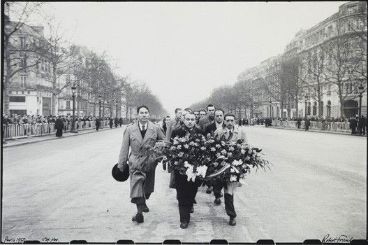 ROBERT FRANK, 11th of November, Paris, 1950: 11th of November, Paris, 1950 Gelatin silver print, printed 1970s. 8 3/4 x 13 3/8 in. (22.2 x 34 cm). Signed, titled and dated in ink on the recto; copyright stamp on the verso. PROVENANCE Robert Frie