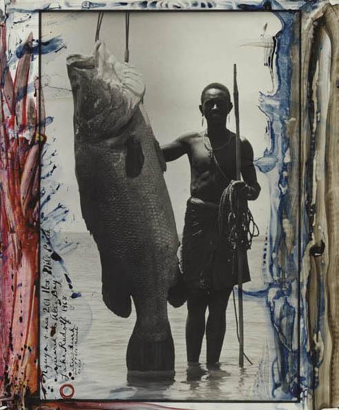 PETER BEARD, Nguya and 201-lb. Nile Perch, Alia Ba: Nguya and 201-lb. Nile Perch, Alia Bay, Lake Rudolf, 1968 Gelatin silver print with ink and paint, printed later. 23 7/8 x 19 7/8 in. (60.6 x 50.5 cm). Signed, titled, dated and extensively annotated