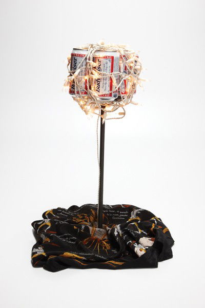 TOM SACHS, Untitled (Beer can sculpture), 1996: Untitled (Beer can sculpture), 1996 Beer cans, electric lights and silk scarf on steel base. 22 x 12 x 12 in. (55.9 x 30.5 x 30.5 cm). Signed, inscribed and dated "Tom Sachs ACRIA Benefit 1996" on the