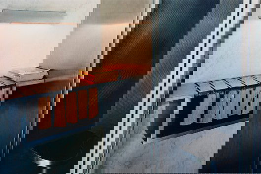 ADAM BARTOS, Secretariat Lobby (telephone booth),: Secretariat Lobby (telephone booth), International Territory, United Nations, 1945-1995 Chromogenic dye coupler print. 20 x 30 in. (50.8 x 76.2 cm). This work is from an edition of ten. PROVENANCE Ros