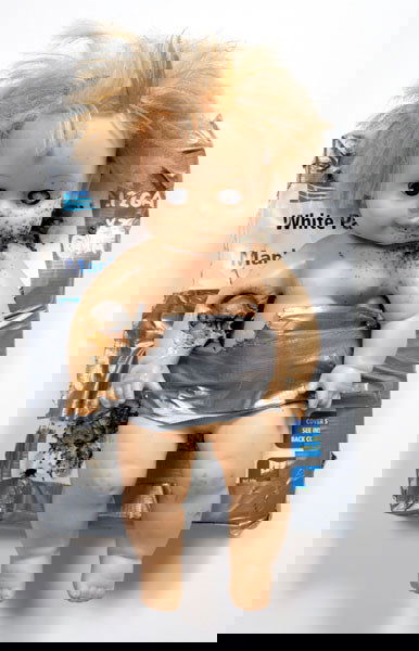 TOM SACHS (b. 1966) BABY DOLL PHONEBOOK SHOT: TOM SACHS(b. 1966)BABY DOLL PHONEBOOK SHOT THRICEsigned and dated "Tom Sachs 1999"on the phonebook spine plastic doll, ph