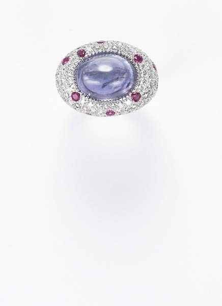 MICHELE DELLA VALLE, A Colored Sapphire and Diamon: A Colored Sapphire and Diamond Ring Centering upon an oval cabochon purple sapphire, within a pavé-set diamond and pink sapphire bombé mount, mounted in 18K white gold, size 6 1/2. Signed xxx