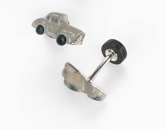 MICHAEL KANNERS, A Pair of Moonstone, Rock crystal: A Pair of Moonstone, Rock crystal. Onyx and Diamond 'Car' Cufflinks Each designed as a carved moonstone car, accented by rock crystal windows, and circular-cut diamond headlights, joined by a polished
