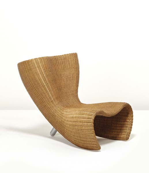 MARC NEWSON, "Wicker" chair, designed 1988: Wicker" chair, designed 1988 Wicker, powder-coated aluminum, chrome-plated aluminum. 29 1/2 in. (74.9 cm) high Manufactured by Idée, Japan. Leg with decal "IDÉE." LITERATURE Alice Rawsthorn, Marc Ne