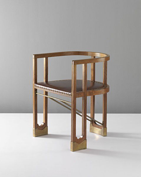 HANS VOLLMER, Very rare armchair, ca. 1901: Very rare armchair, ca. 1901 Oak, leather, brass. 27 5/8 in. (70.2 cm.) high Possibly executed by Prag-Rudniker Korbwarenfabrik, Austria. PROVENANCE Private European Collection; Christie's, The Chair,