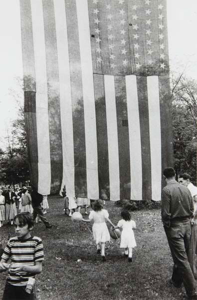 ROBERT FRANK Fourth of July– Jay, New York, 1955: Fourth of July– Jay, New York, 1955 Gelatin silver print, printed 1970s. 12 1/2 x 8 in. (31.8 x 20.3 cm). Signed and titled 'YAJ, N.Y.' [sic] in ink in the margin. LITERATURE Bulfinch Press, On the