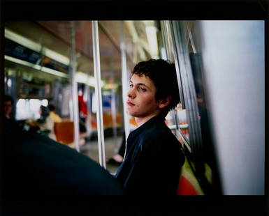 Nan Goldin: Simon on the Subway 1998 Dye destruction print. I. 13 x 19 1/4 in. (33 x 48.9 cm) S. 16 x 20 in. (40.6 x 50.8 cm) Signed, titled, dated and numbered 73/150 in black ink on the reverse, unframed.