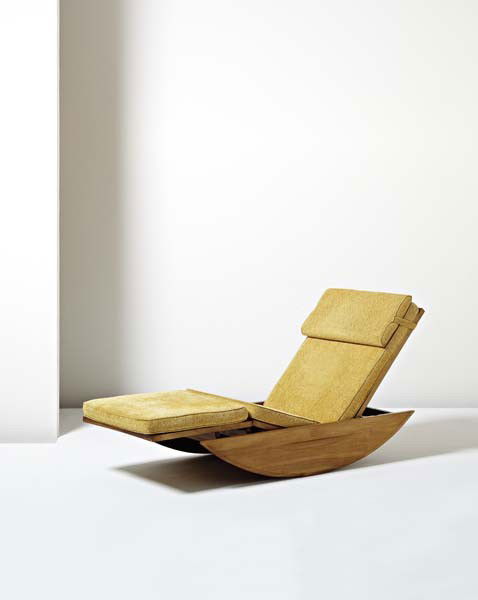 JOAQUIM TENREIRO, Adjustable rocking chaise longue,: Adjustable rocking chaise longue, ca. 1947 Cabreúva, fabric, cane. 32 x 65 1/2 x 26 in. (81.3 x 166.4 x 66 cm.) Produced by Tenreiro Móveis e Decorações, Brazil. Inside of left-facing leg with pap