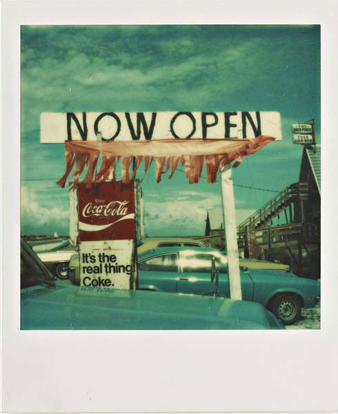 WALKER EVANS, Untitled ('Now Open'), 1974: Untitled ('Now Open'), 1974 Unique Polaroid print. 8 x 7.8 cm (3 1/8 x 3 1/8 in). Dated 'Aug. 6 1974' and annotated in ink on the verso. PROVENANCE Private Collection, Europe