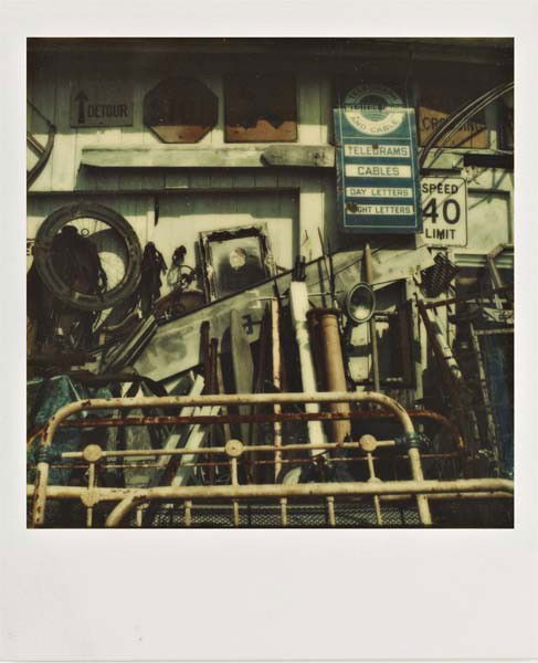 WALKER EVANS, Untitled (Junk shop exterior), 1973-7: Untitled (Junk shop exterior), 1973-74 Unique Polaroid print. 8 x 7.8 cm (3 1/8 x 3 1/8 in). PROVENANCE Private Collection, Europe