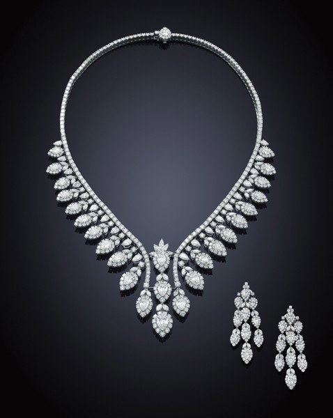 A spectacular diamond necklace and earring suite: A spectacular diamond necklace and earring suite The necklace designed as a graduating fringe of pear-, brilliant- and marquise-cut diamond cluster pendants suspended from a line of brilliant-cut diam