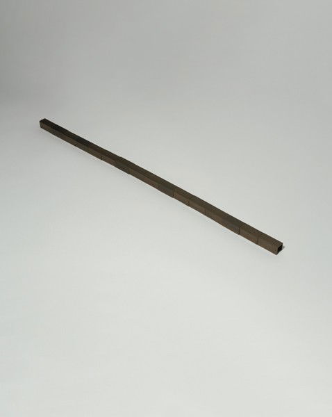 CARL ANDRE, 16 Brass Channel Line, 1977: 16 Brass Channel Line, 1977 Brass in 16 pieces. 56 × 2 × 2 cm (22 × 3/4 × 3/4 in). ‡ PROVENANCE Studio La Città; Private Collection, Spain%