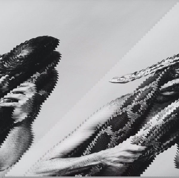 ROBERT MAPPLETHORPE American, 1946-1989 Man i: ROBERTMAPPLETHORPEAmerican, 1946-1989Man in Leather Hood with Snake, 1979.Gelatin silver print.30