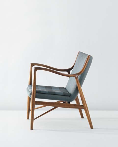 FINN JUHL, Armchair, model no. NV 45, circa 1945: Armchair, model no. NV 45, circa 1945. Cuban mahogany, fabric. 83.2 cm (32 3/4 in.) high Produced by Master cabinetmaker Niels Vodder, Denmark. Stretcher partially impressed with ‘COPENHAGEN DENMARK