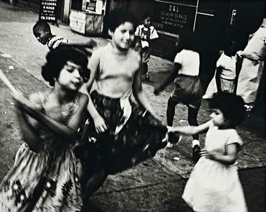 WILLIAM KLEIN, Dance in Brooklyn II, 1955: Dance in Brooklyn II, 1955. Gelatin silver print, printed 1977. 37.5 × 47 cm (14 3/4 × 18 1/2 in) Signed, titled, dated and annotated 'New York no. 24' in pencil on the verso. PROVENANCE Phillips de