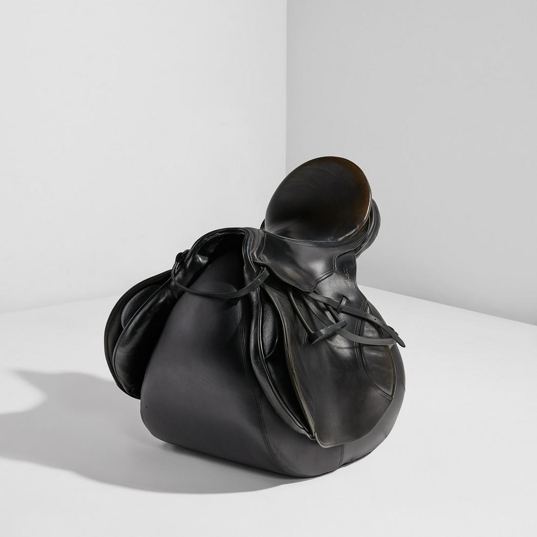 Ika Kuenzel: Caution This Is Rodeo ALL BLACK chair 2006 Stitched leather saddle with patinated steel stirrups, vinyl upholstery. 25 3/4 x 23 1/4 x 24 in. (65.4 x 59.1 x 61 cm) Number 2 from the edition of 100. Pro