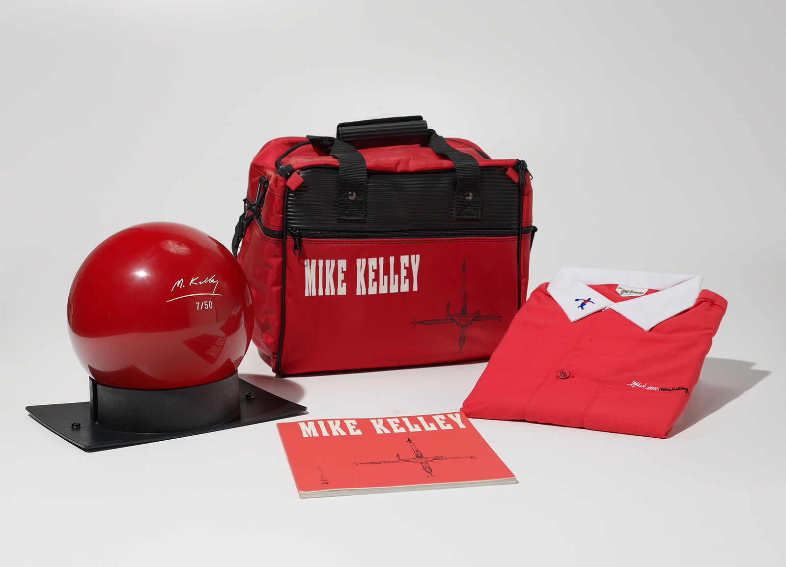Mike Kelley: Bowling Ball, Bag, Shirt and Catalog 1991 The complete set of four objects including a customized bowling shirt with artist's stitched name, bowling ball, bowling bag and book, with accompanying bowli