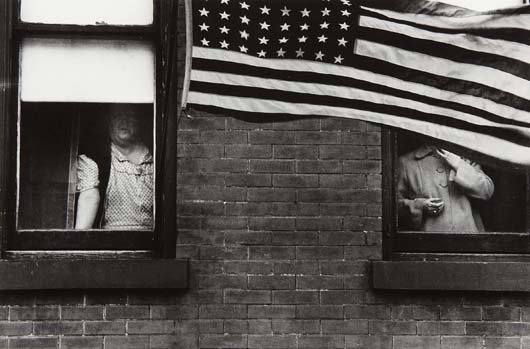 ROBERT FRANK, Parade— Hoboken, New Jersey, 1955: Gelatin silver print, printed 1970s. 8 1/8 x 12 3/8 in. (20.6 x 31.4 cm). Signed, titled and dated in ink in the margin. PROVENANCE Halsted Gallery, Bloomfield Hills