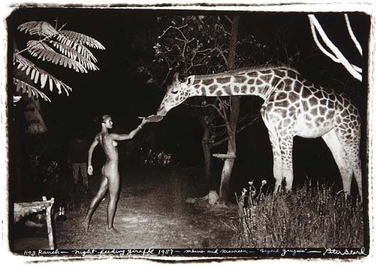 PETER BEARD, Maureen Gallagher and a Late Night Feeder,: Gelatin silver print, printed later. 12 x 18 in. (30.5 x 45.7 cm). Signed, titled, dated and annotated in ink on the recto. PROVENANCE Fahey/Klein Gallery, Los Angeles