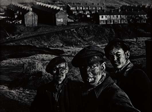 W. EUGENE SMITH, Three Generations of Welsh Miners,: PROPERTY FROM A DISTINGUISHED CALIFORNIA COLLECTION Gelatin silver print, printed later. 10 x 13 1/4 in. (25.4 x 33.7 cm). Signed in stylus on the recto. PROVENANCE G. Ray Hawkins Gallery, Inc., Santa