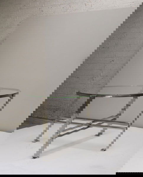 WOLFGANG HOFFMANN Coffee table, ca. 1934 Ma: WOLFGANGHOFFMANNCoffee table, ca. 1934Manufactured by Howell Company, USA; chrome-plated steel, glass