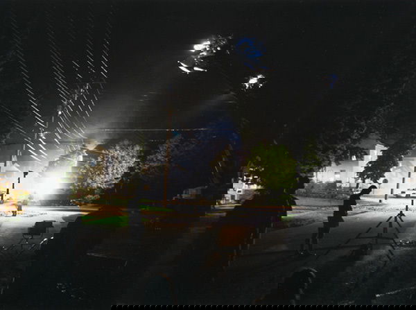 GREGORY CREWDSON b. 1962 Production Still (Li: GREGORYCREWDSONb. 1962Production Still (Library Street) "Beneath the Roses", 2003Digital chromogenic print.