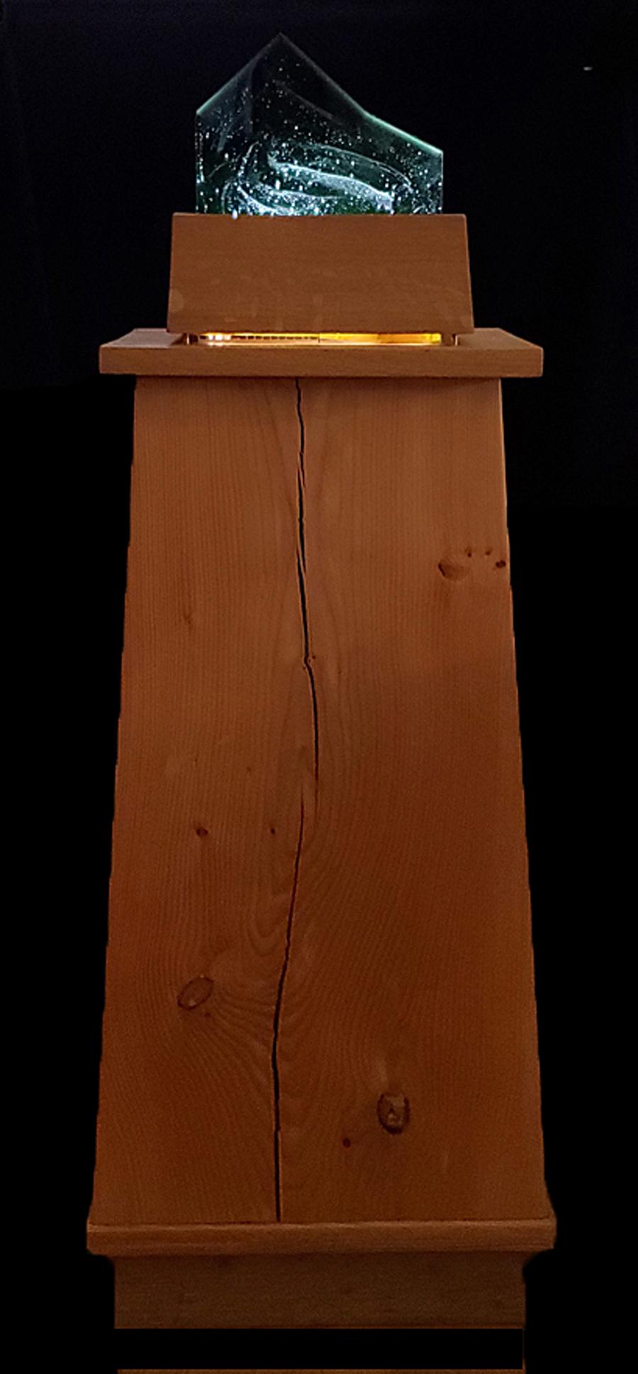 Copt, Louis - kiln cast glass with lit base on a: "Grey Barn Galaxy," kiln cast glass with lit base on a plywood pedestal, glass barn dimensions are 6.5"x8"x5" and the dimensions including the base and pedestal are 44"x14"x10." Artist Louis Copt was