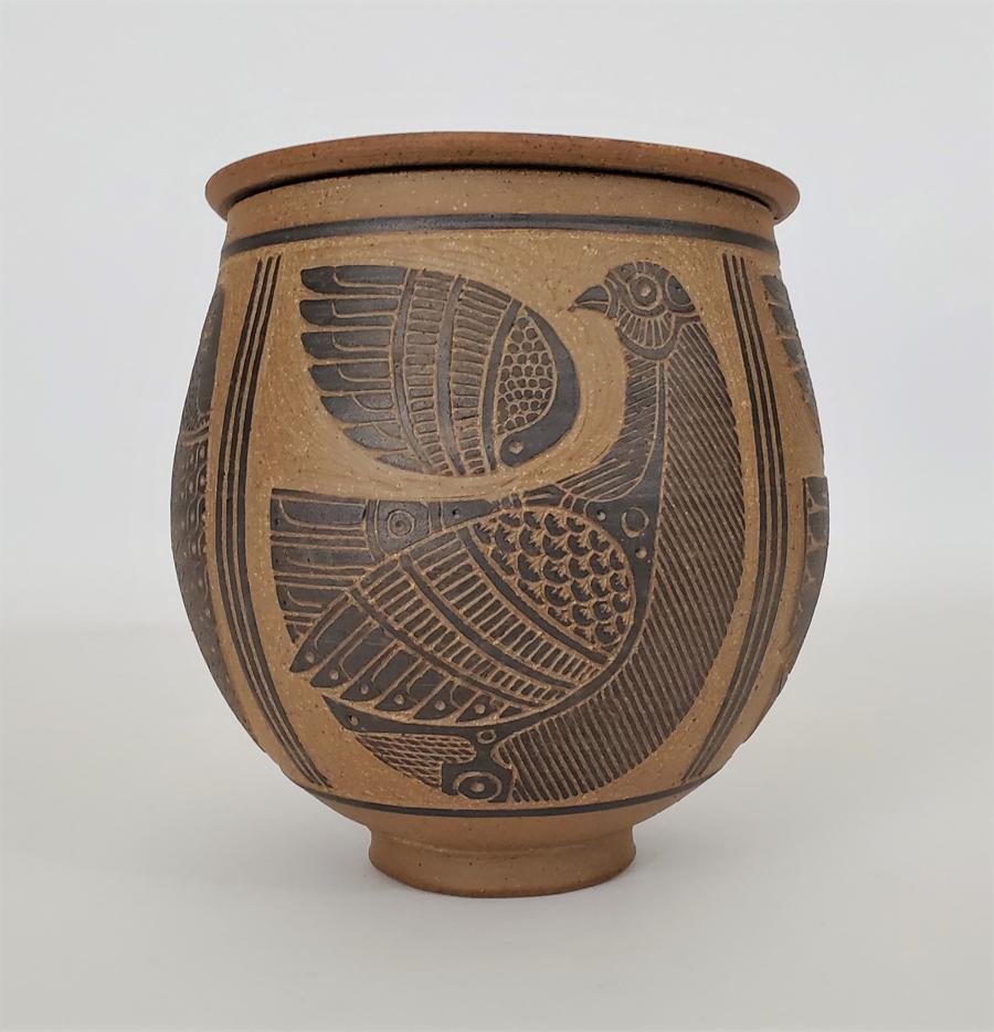 Barker, Edward - stoneware, very good condition, 8x7.5: Hand thrown bird decorated stoneware jar with lid by Wellington, Kansas studio pottery artist J. Edward Barker (b. 1938), signed 'Barker' on the base. Incised design with black glazed interior. In ver
