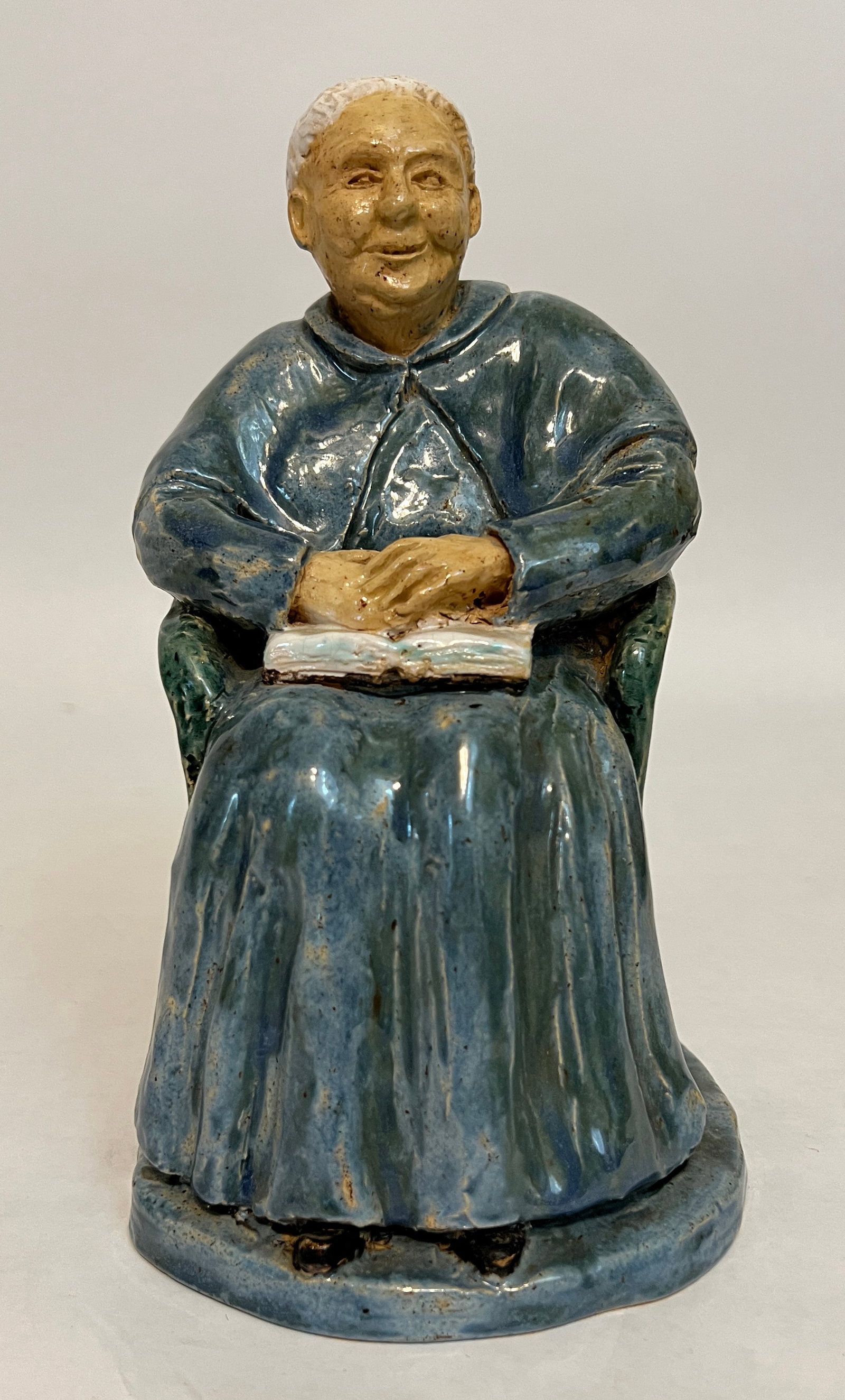 Runbeck, Lucile (1921-?) ceramic, seated old woman: Lucile Runbeck (1921-?) seated old woman, ceramic, signed in base and on bottom, good condition, no chips or cracks, size: 8" x 5.5" x 4.5". Born in McPherson. Painter. Ceramist. Studied at the Univer