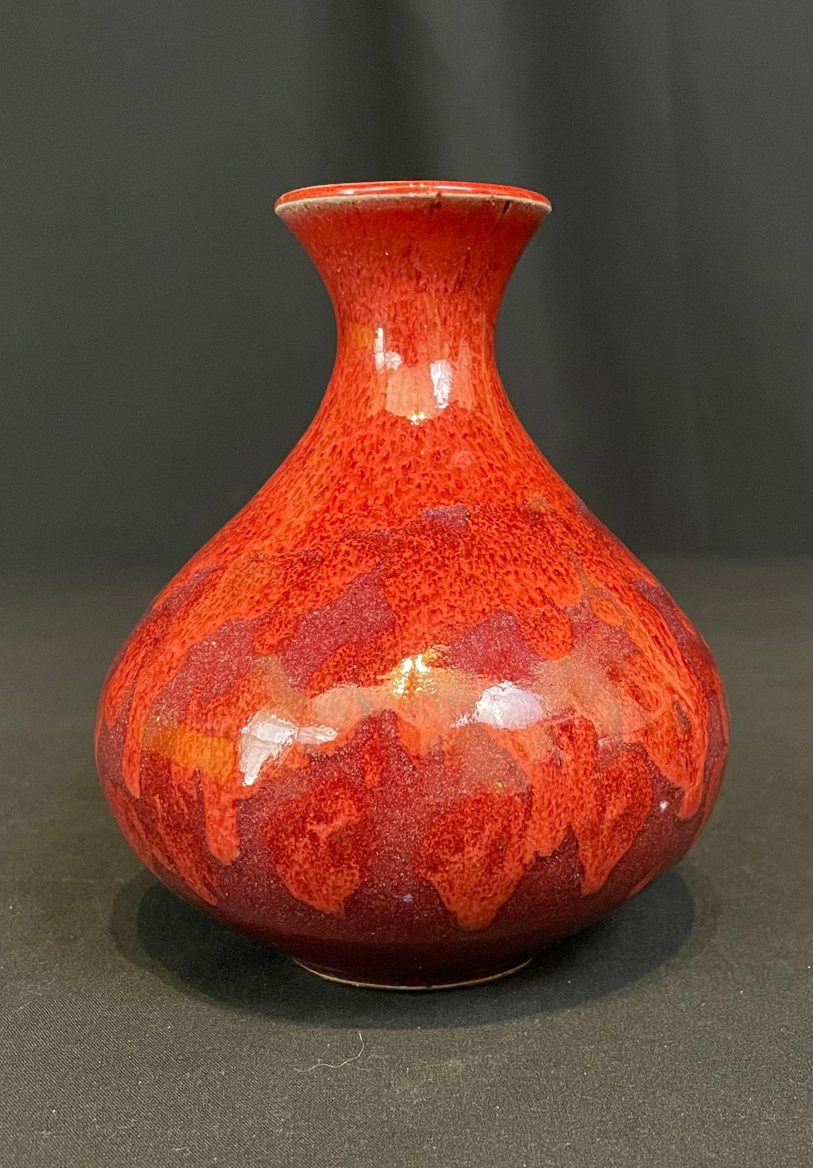 McCallum, Brian, stoneware, red vase: McCallum, Brian, stoneware, red vase, no visible signature, good condition, no chips or cracks, vase size: 6 x 5 x 5 inches. McCallum is an artist and educator living on the high plains. His art is mo