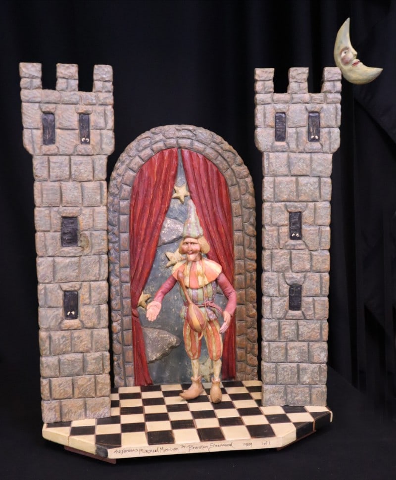 Sherwood, Brandon, 1989 woodcarving/polychrome, The Forest Minstrel Musician: Sherwood, Brandon, 1989 woodcarving/polychrome, The Forest Minstrel Musician, signed by Brandon Sherwood on front of stage, good condition, size of complete woodcarving: 26 x 21.5 x 12 inches. The woo