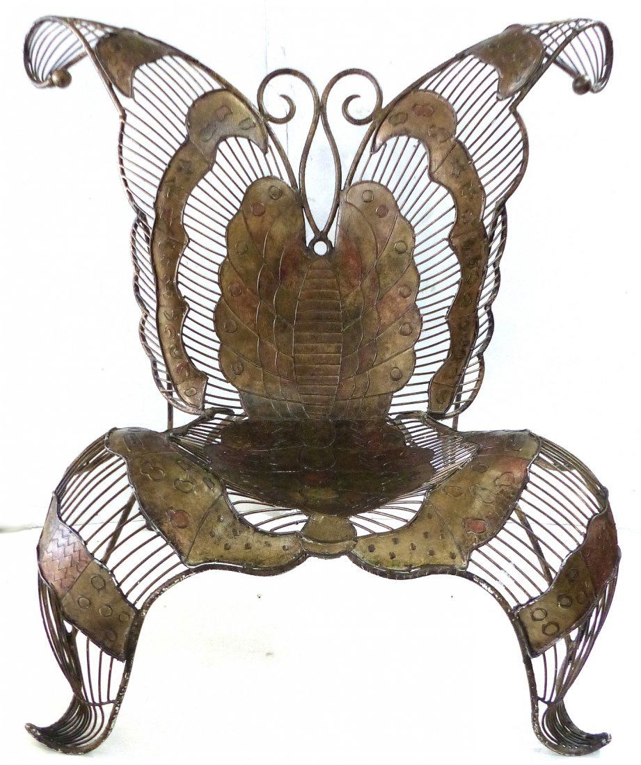 Monumental Artist Sculpted Iron Butterfly Chair: Large decorative iron butterfly sculptural lounge chair finished in copper and gold tones. Seat, 16"H. A few scuffs on legs. 33" L x 44.5" W x 44.5" H