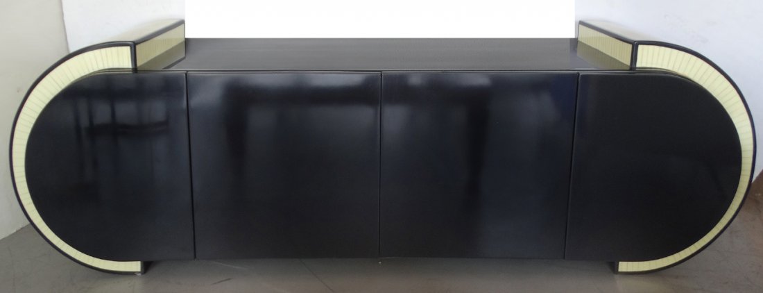 Faux-Painted- Bone Buffet Attri. to Pierre Cardin: Mid-Century Modern black lacquered buffet attributed to Pierre Cardin with rounded ends and faux-painted bone accents. Two rounded end doors open inward to reveal storage. Two center doors with two la