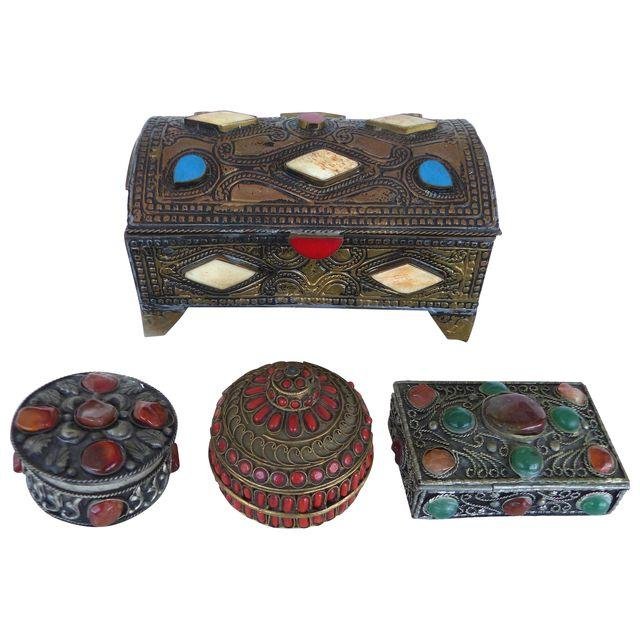 Collection of Metal Boxes W/ Stone & Bone- Set of 4: A collection of 4 hand-crafted metal lidded boxes embellished with bone and various stones. The larger domed box, 6.75\"L x 4.5\"W x 3.5\"H. Small coral box,2.36\"Dia, x 2.12\"H. Small amber, 2.25\"Di