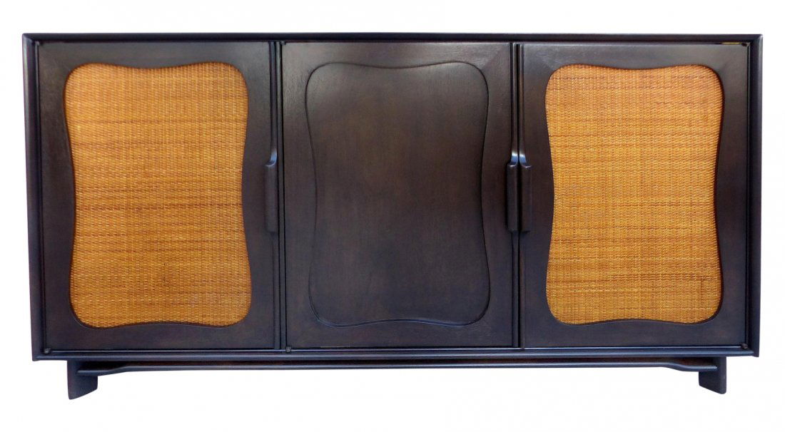Mid-century Lacquered 50's Credenza W/ Woven Cane Doors: A newly lacquered 1950's Mid-Century Modern three-door mahogany credenza with woven cane doors supported by a floating frame. Maker's labels inside the door; a shelf within the left single door side.