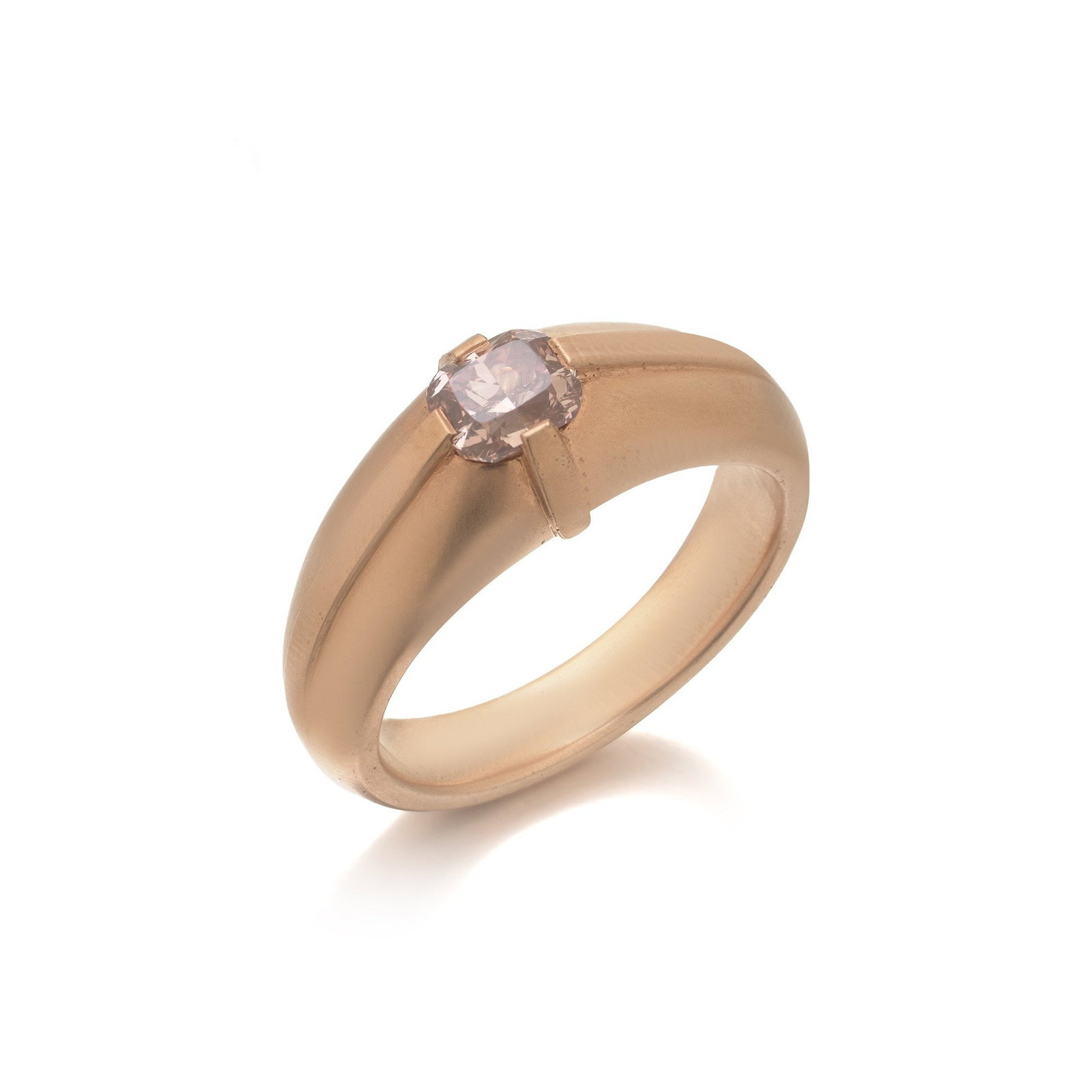 Antique Natural Pink Diamond Ring, 18KT Gold Gypsy-Set Solitaire: A natural pink diamond ring of real rarity, an old cushion-cut diamond of genuine pink body colour, gypsy-set flush into the crown of a heavy domed 18KT gold band. Naturally coloured pink diamonds acc