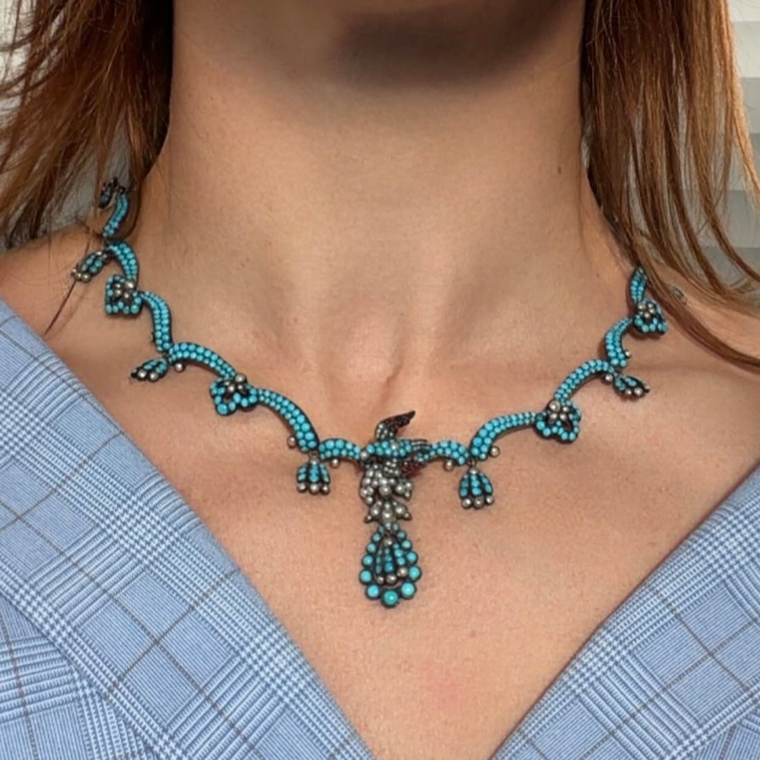 Victorian Natural Turquoise & Pearl Necklace, Circa 1860: Exceptional mid-19th century Victorian turquoise and pearl necklace featuring a sculptural bird-form pendant pave-set with natural turquoise beads and natural seed pearls. Constructed in articulated s