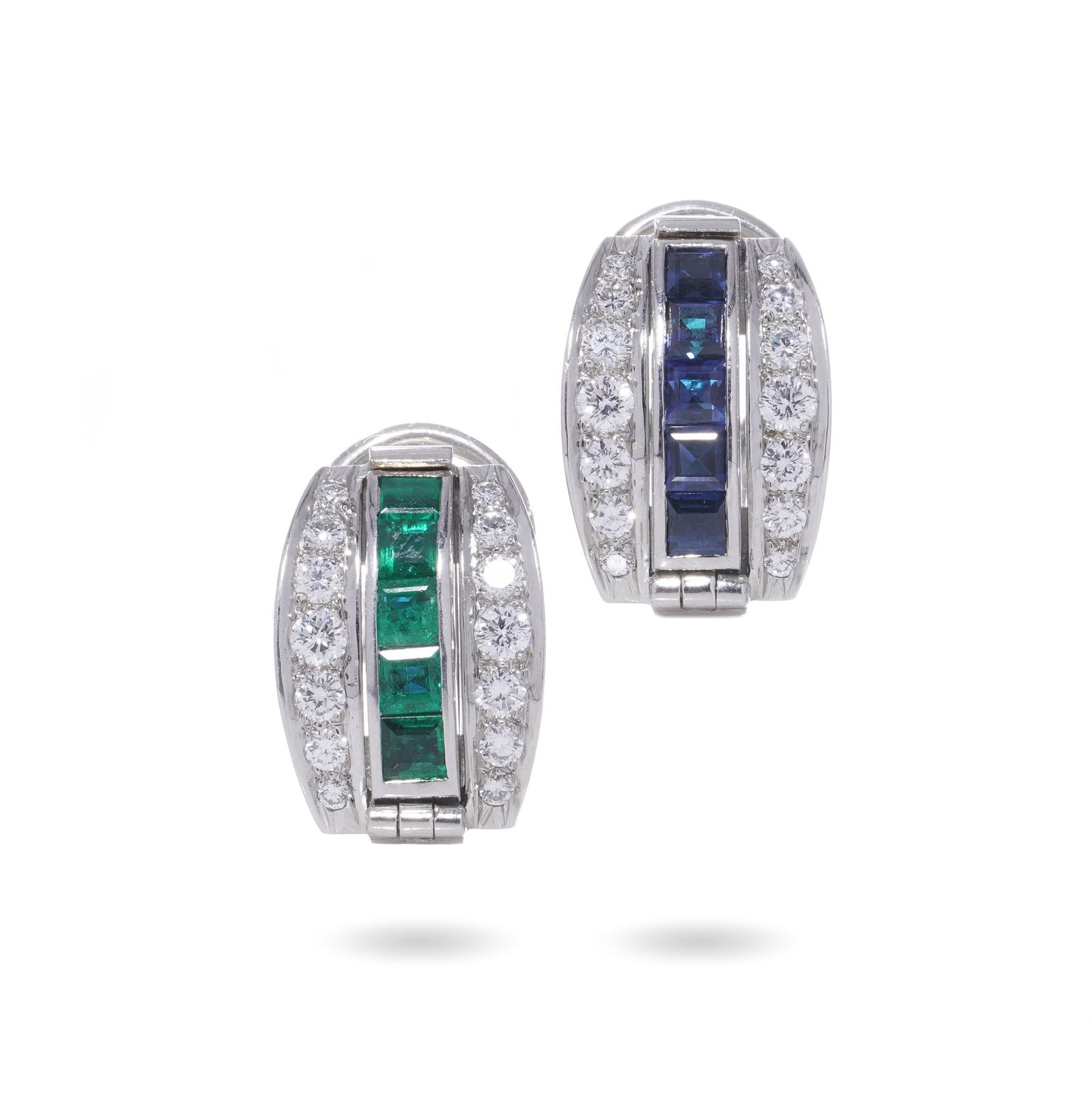 Tiffany & Co. platinum reversible earrings, sapphire, emerald and diamond: These elegant earrings are crafted in 18kt gold, designed as clip-ons for comfort and secure wear. Each earring features square-cut sapphires and emeralds, bordered by pav-set brilliant-cut diamonds t