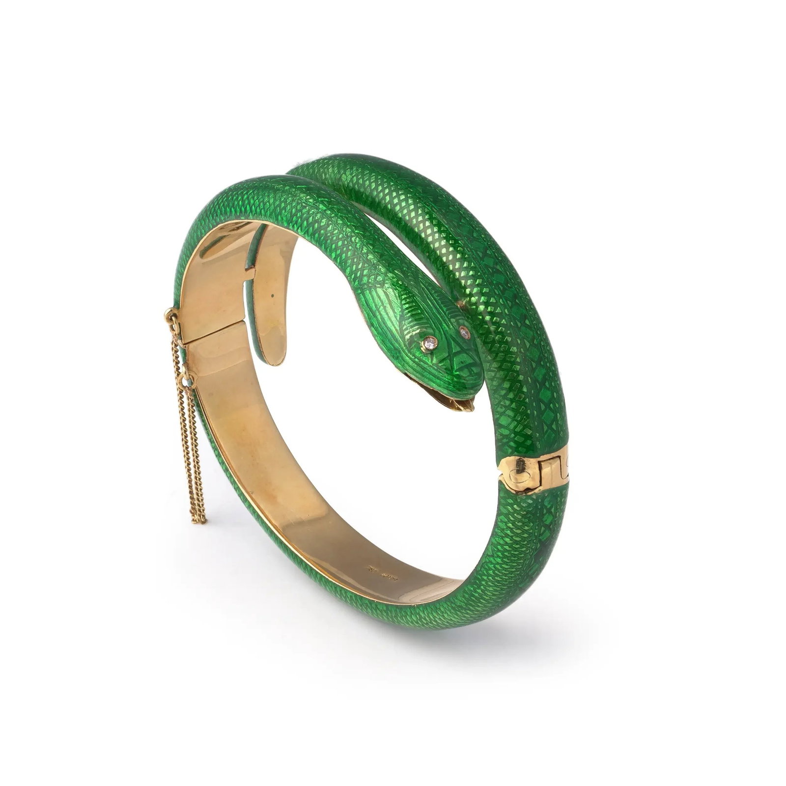 Vintage Green Enamel Snake Bracelet 18KT Gold Circa 1970s: A striking vintage snake bracelet crafted in 18KT yellow gold and finished with vibrant green enamel, dating to the 1970s. Designed as a coiled serpent, the bracelet wraps elegantly around the wrist, 