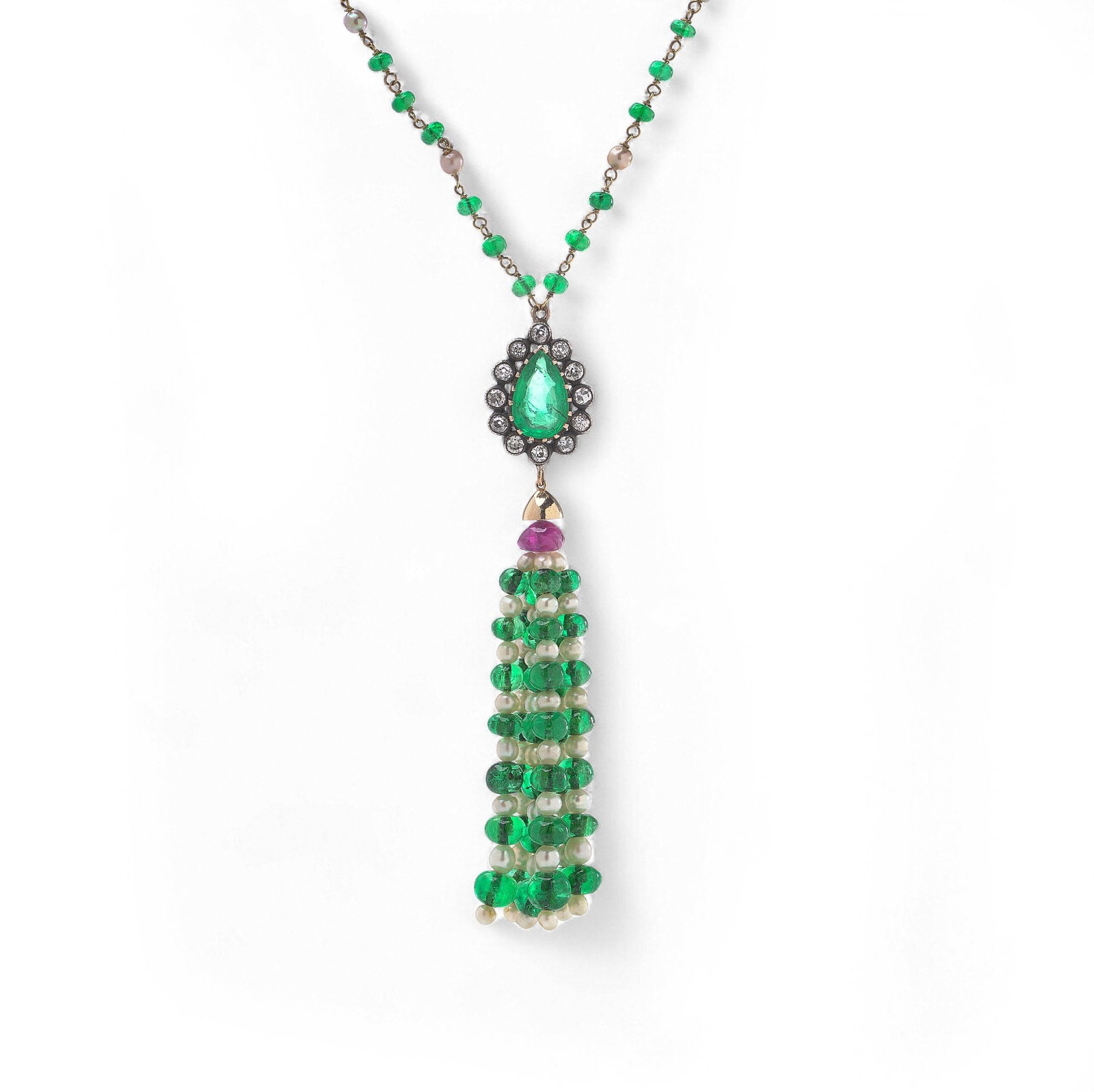 15KT Gold and Silver Emerald, Ruby, Pearl and Diamond Necklace: An ornate 15kt gold and silver necklace featuring a tassel pendant suspended from an emerald- and diamond-set cluster surmount. The pendant is composed of alternating strands of emerald beads and natu
