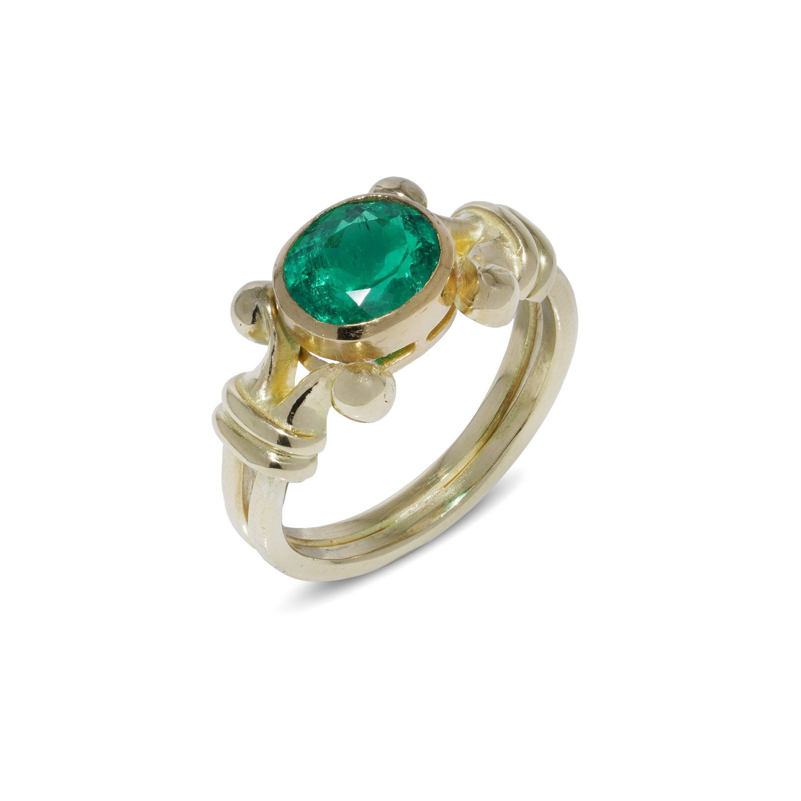 Theo Fennell 18KT Gold Ring with 1.50ct Oval-Cut Emerald: A striking ring by renowned British designer Theo Fennell, crafted in 18kt yellow gold. The centrepiece is a natural Colombian emerald weighing approx. 1.50 carats, oval-cut and transparent, with mode